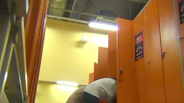 This dudes hidden camera is very hard to find in this locker room