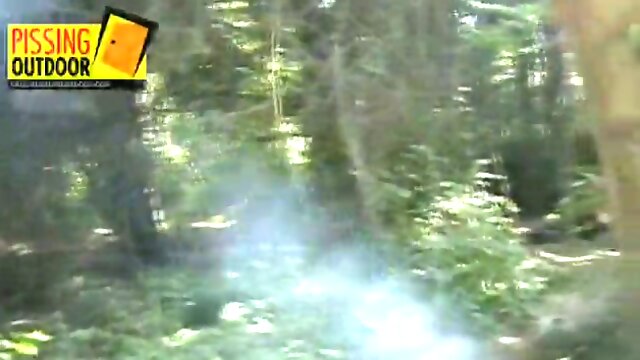 Two sweet blonde girls kiss in the forest and piss