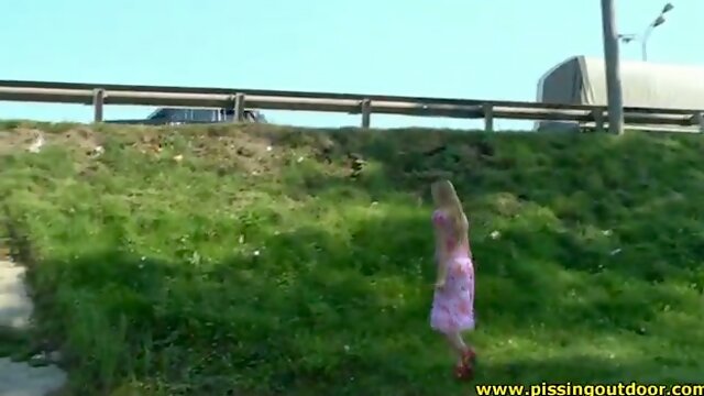 Cute blonde girl with fluffy pussy pisses near the road