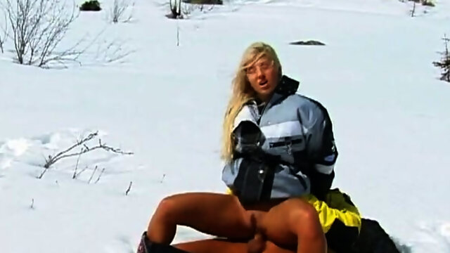 Desirable blonde bitch fucks a horny guy on the ski trail