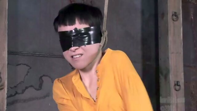 Short-haired bitch Mei gets suspended and face-fucked in BDSM clip
