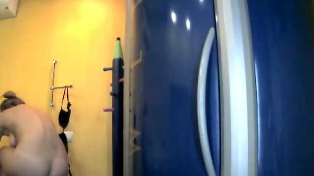 Hidden cam in Russian solarium caughty naked woman rubbing her body with cream