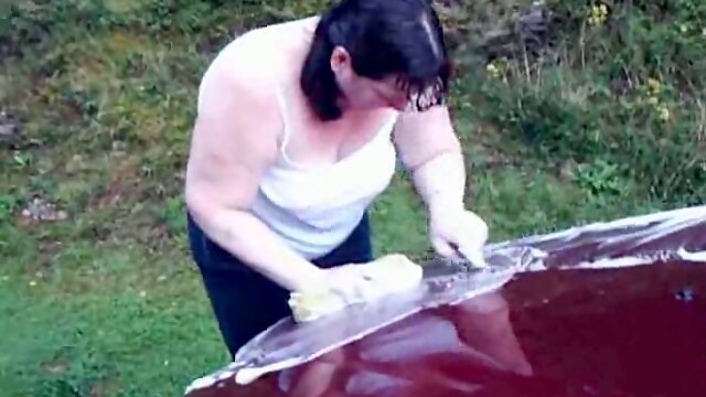 Fat sister of my neighbor washes her car flashing one of her boobs