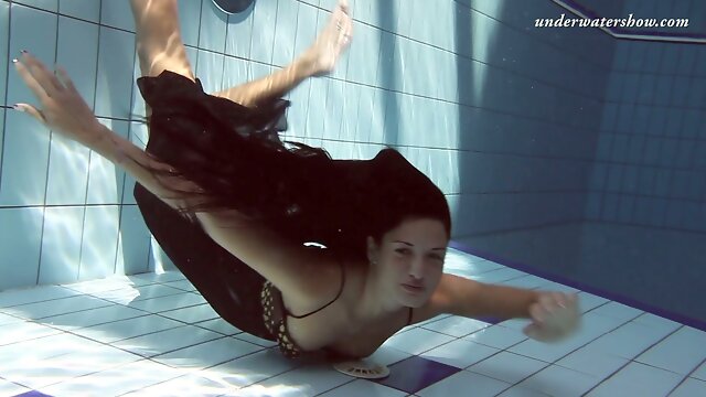 Zhanetta swimming in a pool like a mermaid in the sea