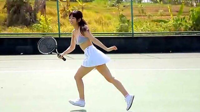 Sassy Asian girl Yuka Hirata plays tennis on the court