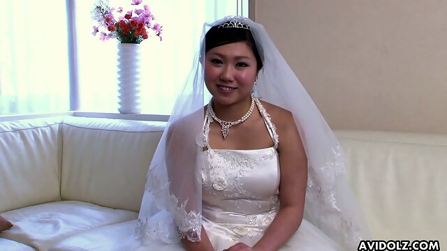 Just ordinary cute Japanese bride Emi Koizumi posing in wedding dress