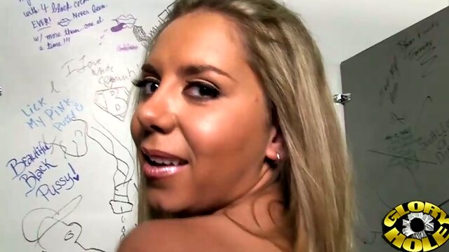 Big boobed blond lady Allie Foster licks black sweet cock through glory hole