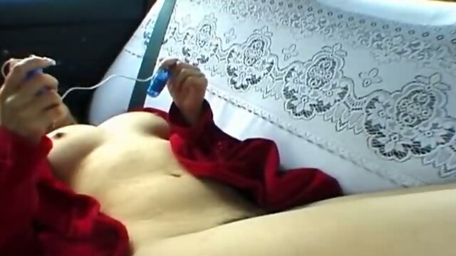 Kinky Asian slut in red coat masturbates on the back seat of car