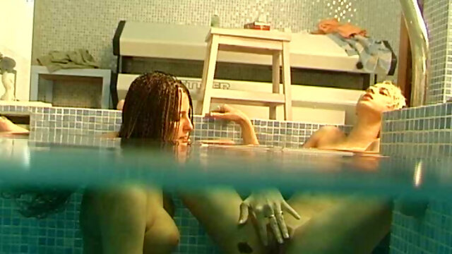 Barely legal lesbians do it in swimming pool with great pleasure