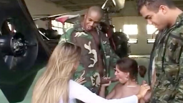 Blonde sweetie gives blowjob to pilot in military helicopter