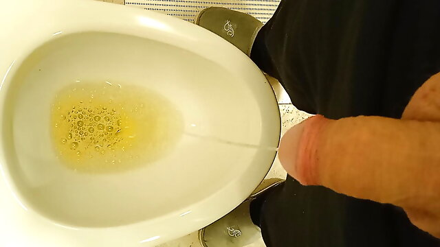 Daddy takes a piss and showing off soft cock