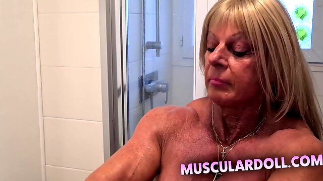 Professional Female Bodybuilder Put Cream On Her Nude Muscle Body