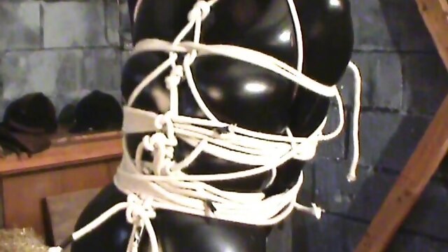 Post tied and ballgagged in catsuit