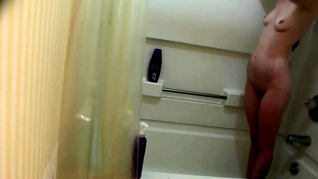 My stepsister soaps up her slender body