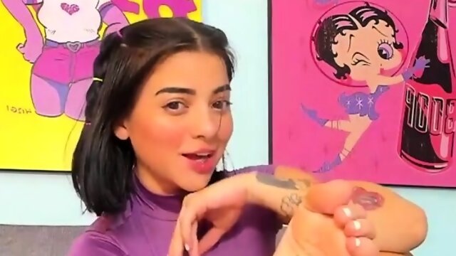 Brunette with foot fetish rubs big dick with her feet in POV