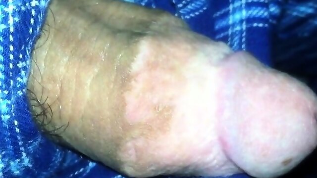 Big fat plum headed cock snakes its way out of pajama pants