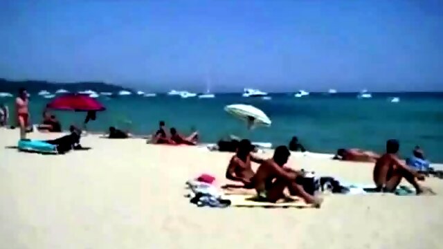 Girl self fingering on a public beach while her husband film