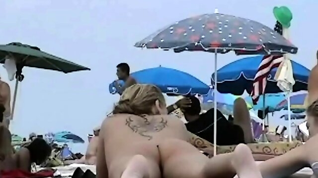 Very horny milf rubbing boobs in nude beach