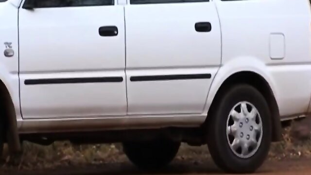 African Hooker Slurps Long White Cock In Car