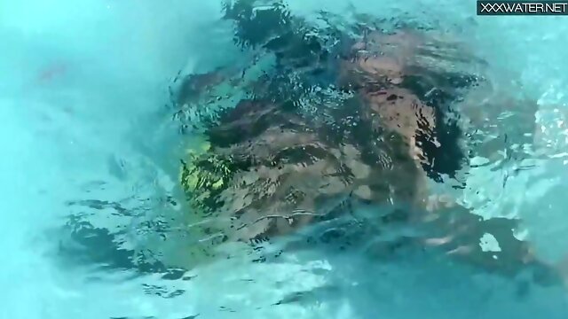 Minnie Manga romps and inhales underwater