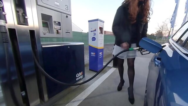 Getting gas crossdressed in white mini-skirt