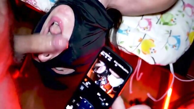 Hooded gal is getting a rock rock-hard boner down her gullet, in front of the camera