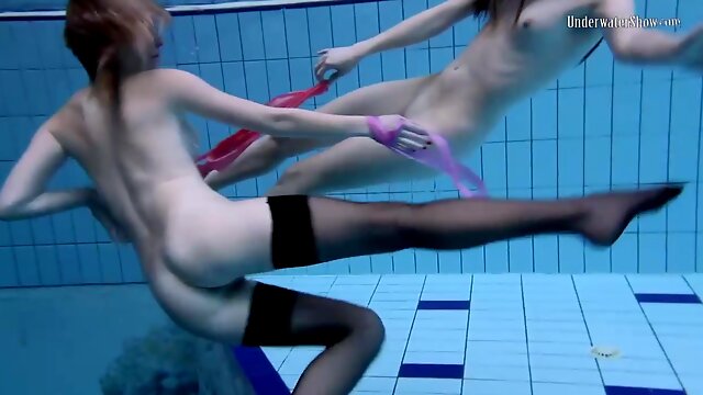 Wondrous female in glamour stocking is having underwater joy with her gf, while no one is eyeing