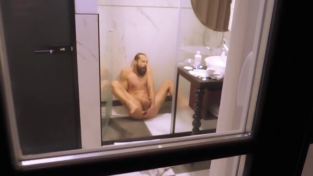Mature boy filmed from outside while taking a bathroom and wanking off his rock hard wood