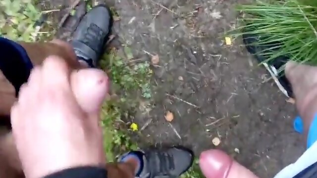 Two men masturbating down the forest