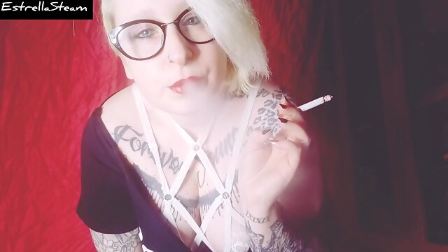 Blonde Smokes A Cigarette While Staring At You