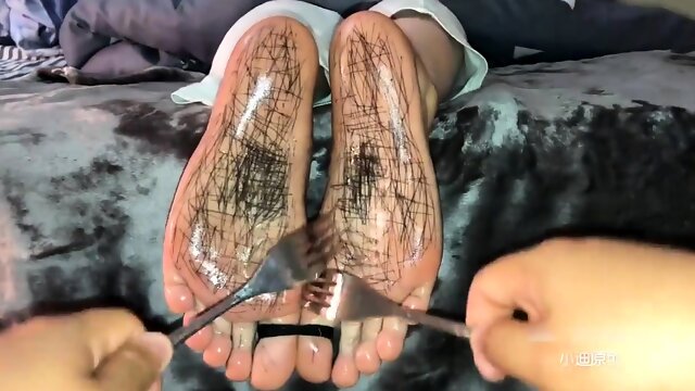 Restrained Asian babe trained in foot fetish submission