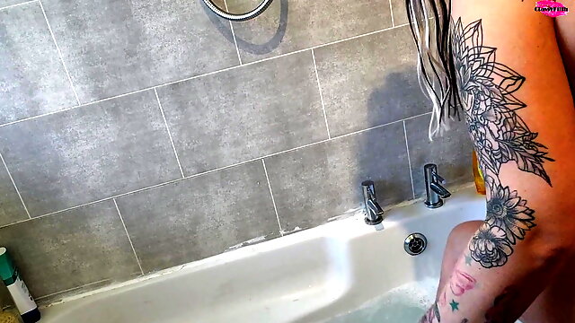 Curvy MILF getting in the bath