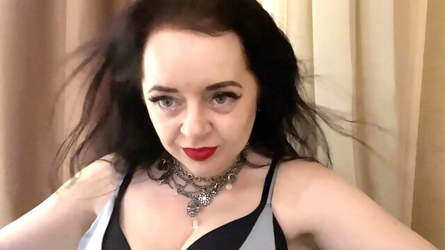 Horny and hot Mistress Lara plays with her boobs dressed in luxury outfit