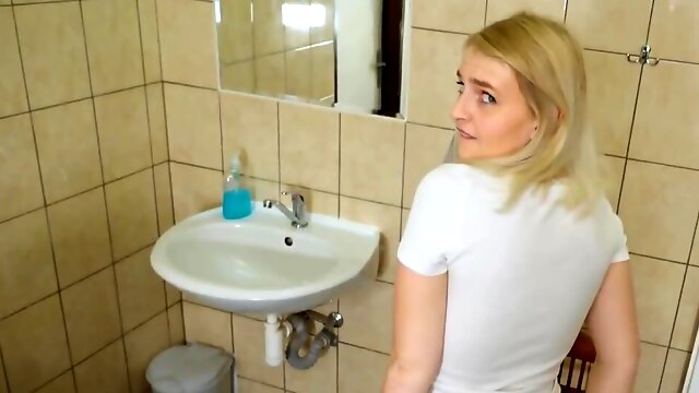 Cute blonde is fucked in the toilet next to a cuckold boyfriend