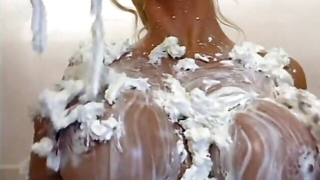 Guy licks MILF's cream covered tits before pounding her in the bathtub