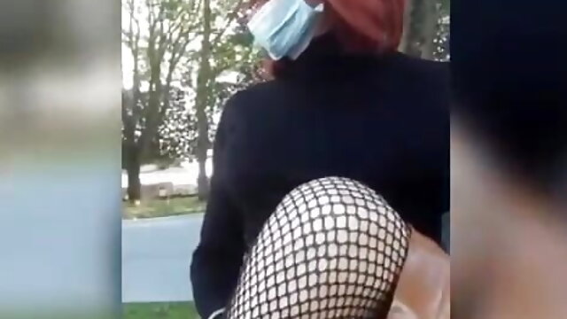 Sissy slut in bourgeois outfit at the public garden