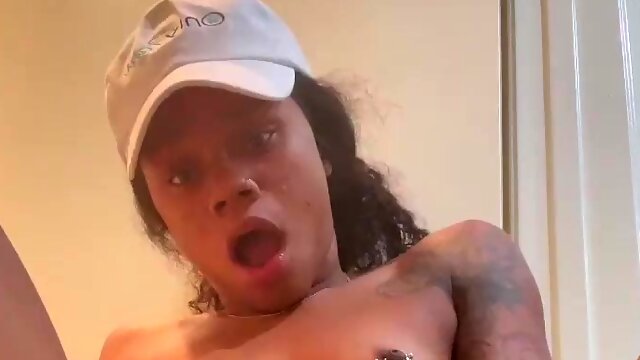 A cute black girl gets a squirt and an orgasm from a glass toy.