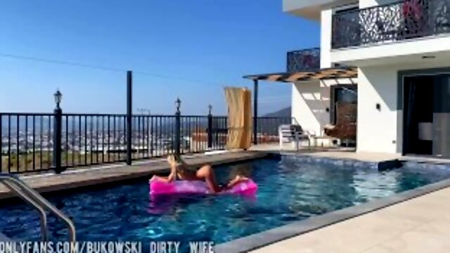 A beautiful blonde masturbates in the pool and lures a peeping guy into a blowjob