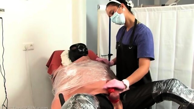 Femdom nurse working her skilled hands on slaves cock