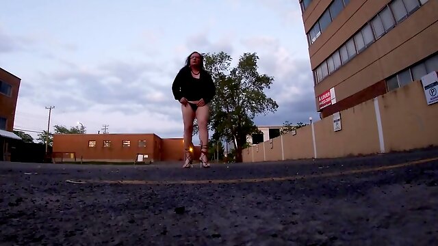 Mature Sissy TV ambling the Parking Plenty Of at dusk