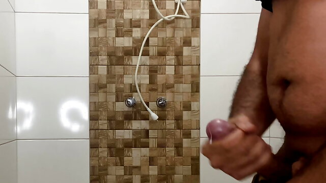 Big-headed brunette in the work bathroom jerking off, cumming