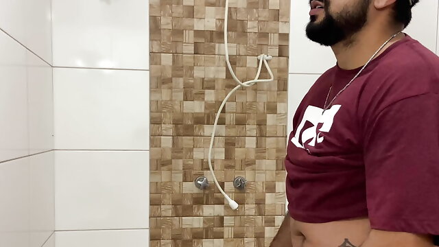 Squirting cum, bearded in a cap alone in the bathroom having fun in the handjob until cumming a lot - Rodrik Dick