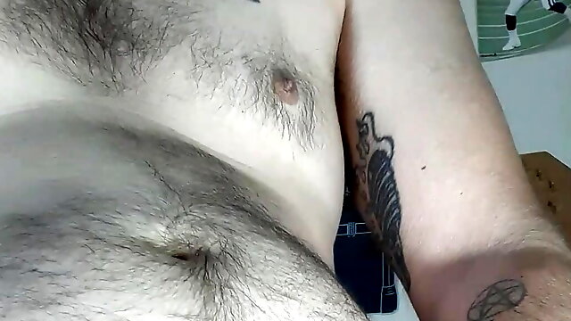 Panty boy plays with his floral lace panties while watching a goon video and licks his cum up