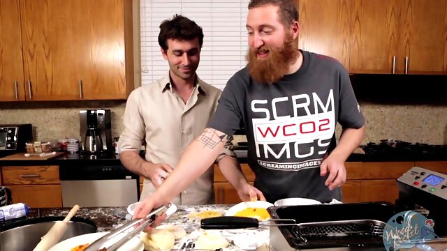 Handsome dude enjoys while making dinner in the backstage