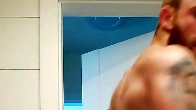 Muscular guy is doing muscle worship and masturbate with cum