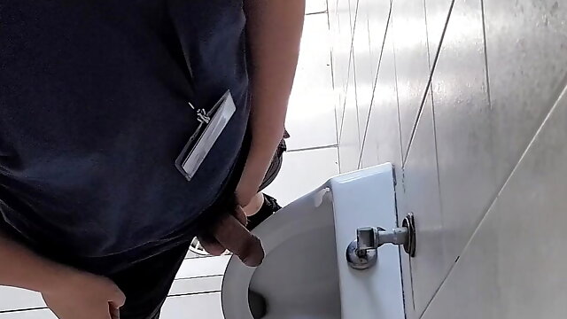 Risky wank in public urinal 