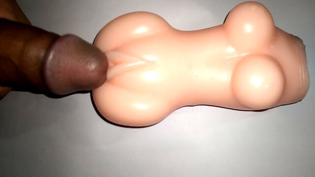 Sex doll dick rubbing.
