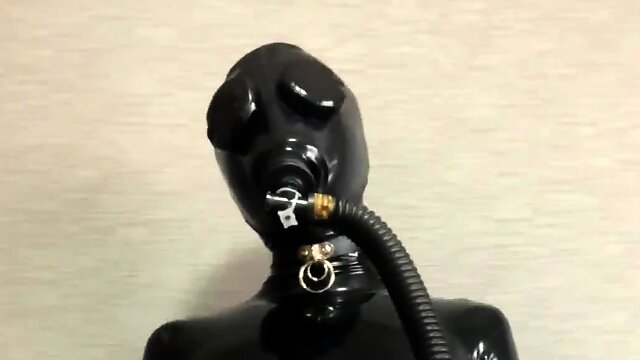 Gas mask breathing control