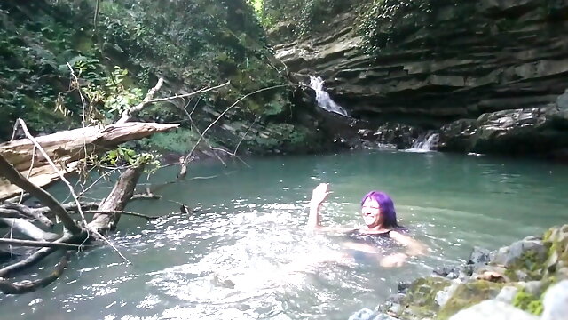 Alexa Cosmic transgirl swimming at waterfall in shirt and t-shirt... 