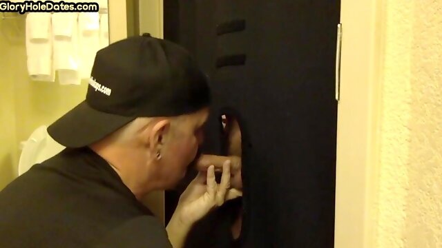 Gloryhole gay shows sucking skills while jerking dick